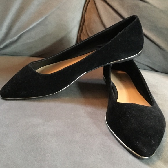 black flats with gold trim